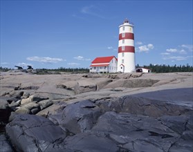 Pointe-des-Monts lighthouse in summer, North Shore, Quebec, Canada, North America