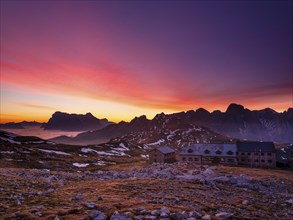 Schlernhaus at dawn, Sassolungo Group and Catinaccio behind, Dolomites, Sciliar, South Tyrol,