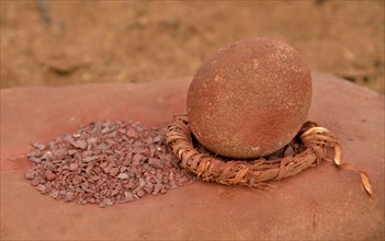 Grinding tool and red iron rocks ??used for the traditional skin cream of the Himba, Omuramba,