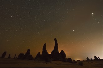 Starry sky above the mystical rock formations of Gharameel, AlUla region, Medina province, Saudi