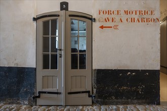 Hallway with directions inside Fort van Liezele, fortress of the fortified area of Antwerp,