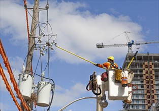 Toronto, Canada-10 February, 2020: Contractor at work fixing electric lines