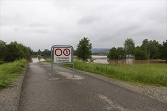 Symbolic image extreme weather, global warming, climate change, information board, flood retention