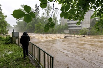 Symbolic image extreme weather, global warming, climate change, flood, flooded weir in Remseck an