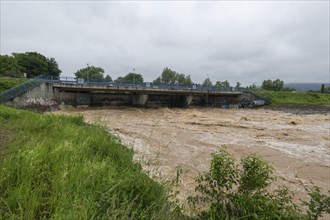 Symbolic image extreme weather, global warming, climate change, barrier, flood protection, bridge,