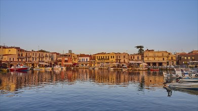 Morning light, sunrise, Venetian harbour, row of houses, colourful houses, reflections in the