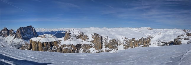 Panorama of a ski resort piste and Dolomites mountains in Italy from Passo Pordoi pass. Arabba,