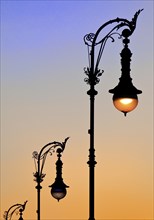 Old Berlin gas lanterns in the street Unter den Linden At sunset, Berlin, Germany, Europe