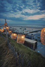 String of lights on the beach at blue hour, Zandvoort, Netherlands