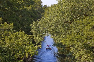 Couple in a pedal boat on the river Lahn, Marburg, Hesse, Germany, Europe