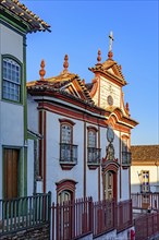 Baroque church facade and colonial houses in the city of Diamantina in Minas Gerais, Brasil