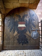 Entrance gate with coat of arms, coat of arms of the city of Nuremberg with double-headed eagle,