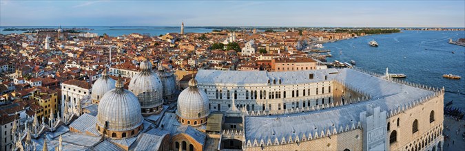 Aerial panorama of Venice with St Mark's Basilica and square and Doge's Palace on sunset from St