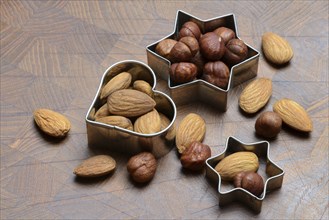 Nuts and cookie cutters, almonds and hazelnuts