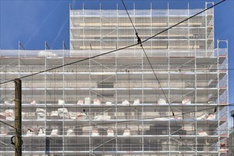 Karlsruhe, Germany, August 2021: Large construction site with scaffolding on multistory building