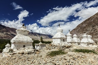 Whitewashed chortens (Tibetan Buddhist stupas) . Nubra valley, Ladakh, India, Asia