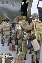 Uniforms of American soldiers and Douglas C-47 aircraft in the Airborne Museum in