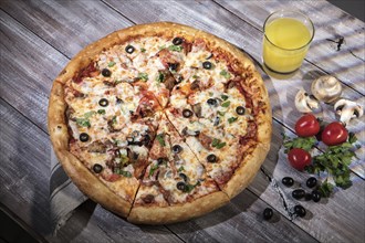 Pizza on an old wooden table