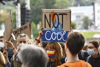 Heidelberg, Germany, 24th September 2021: Sign held up by young woman saying 'Not cool' at Global