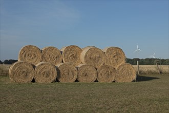 Stack of round bales, straw, wind turbines, agriculture, Allerstorf, Marlow, Mecklenburg-Western