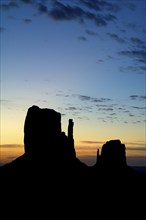 Rock formation the Mittens, sandstone rocks silhouetted at sunset, Monument Valley Navajo Tribal