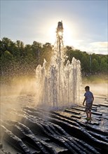 Boy at the fountain in the Lustgarten, Museum Island, Berlin, Germany, Europe