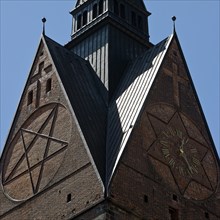 Tower detail of the Marktkirche St. Georgii et Jacobi with hexagram and tower clock, state capital