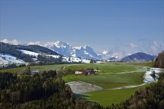 Mountain farm in the valley and snow-covered Großer tidal creek, spring, Alps, Upper Austria,