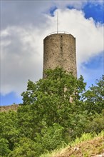 Tower of German castle ruin and restaurant called Strahlenburg in Odenwald forest in Schriesheim