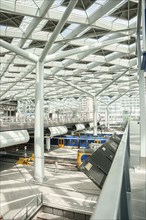 Impressive white interior architecture at railway station, The Hague, Netherlands