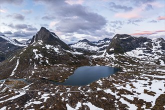 Lake Alnesvatnet with mountain landscape of Reinheimen National Park, Norway, Europe