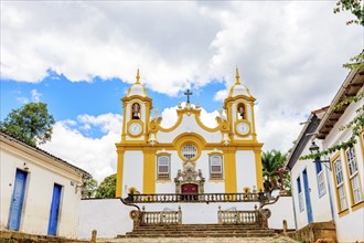 Houses and historic church in an old cobbled street in the famous city of Tiradentes in Minas