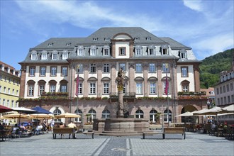 Heidelberg, Germany, April 2020: Old historic city town hall at marketplace with fountain and