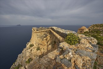 Venetian sea fortress Gramvoussa, morning light, cloudy sky, fortress walls, Pontikos Island,