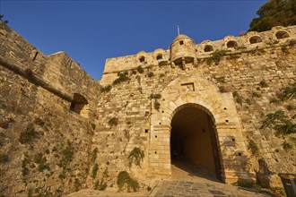 Fortezza, Venetian sea fortress, entrance gate, round defence defence tower, fortress walls, blue