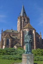 Old Gothic abbey church with monk Paul in Wissembourg, Alsace, France, Europe