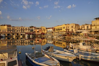 Morning light, sunrise, Venetian harbour, row of houses, colourful houses, blue sky, few grey-white