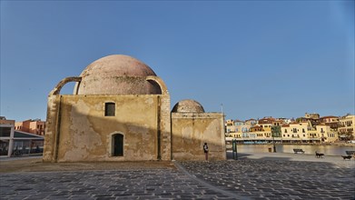 Venetian old town, Venetian harbour, mosque, row of houses, colourful houses, blue cloudless sky,