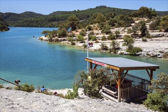 Bathing spot on the rocky beach at Lac d Esparron, Esparron-de-Verdon, Provence-Alpes-Côte d'Azur,