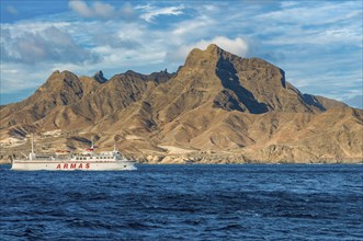 Ferry in the sea, mountains in background. San Vincente. Mindelo. Cabo Verde. Africa