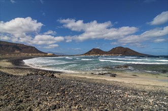 Vulcanic cone and beach with pebbles. San Vincente. Cabo Verde. Africa