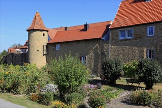 Part of the old town wall and in front of it the moat gardens, Mainbernheim, Lower Franconia,