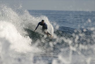 Surfer near Punta del Hidalgo, Tenerife, Canary Islands, Spain, Surfers near Punta del Hidalgo,