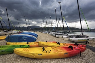 Boats on the beach in Sainte Croix du Verdon, Lac de Sainte-Croix, thunderstorm atmosphere,