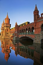 Oberbaum Bridge over the Spree with yellow underground, Friedrichshain-Kreuzberg district, Berlin,