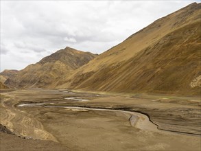 Dried up riverbed in mountain landscape, highlands of Tibet, China, Asia