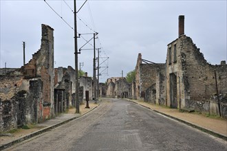 Ruins along the main road The burnt village of Oradour-sur-Glane was destroyed on 10 June 1944 when