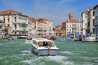 VENICE, ITALY, JULY 19, 2019: Boats and gondolas on Grand Canal, Venice, Italy, Europe