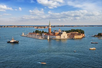 Famous Italy tourist destination, aerial view of Venice lagoon, San Giorgio di Maggiore church San