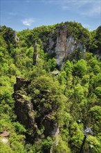 Famous tourist attraction of China, Zhangjiajie stone pillars cliff mountains with cable railway